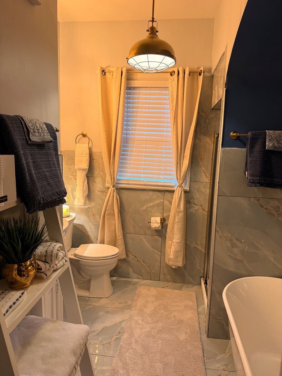Blue Magnolia bathroom with glass shower and tile floor
