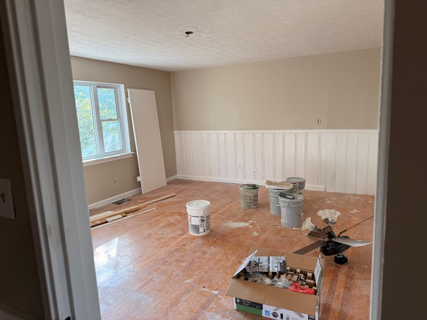 Rosedale project — bedroom mid renovation, subfloor exposed and trim in progress