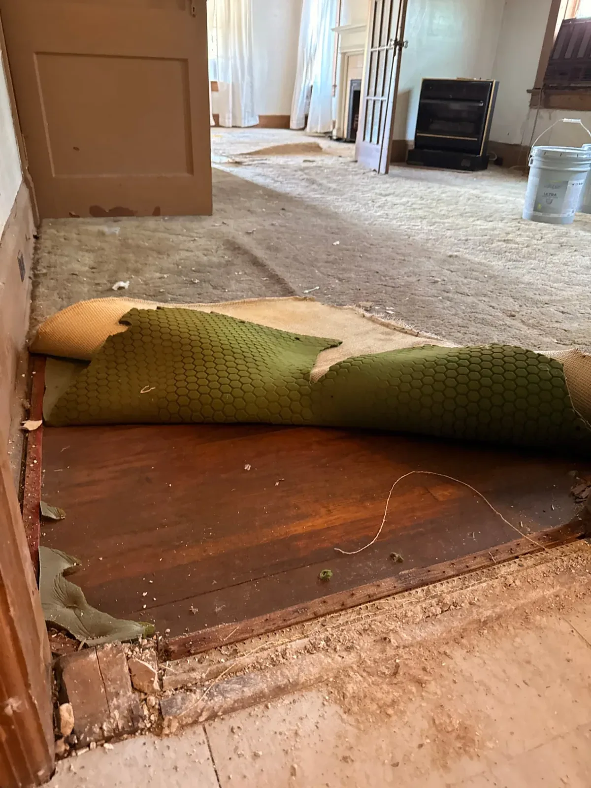 Original hardwood exposed beneath carpet before renovation, The Ridgecrest Remodel, Ridgecrest / Southern Meadows, Montgomery
