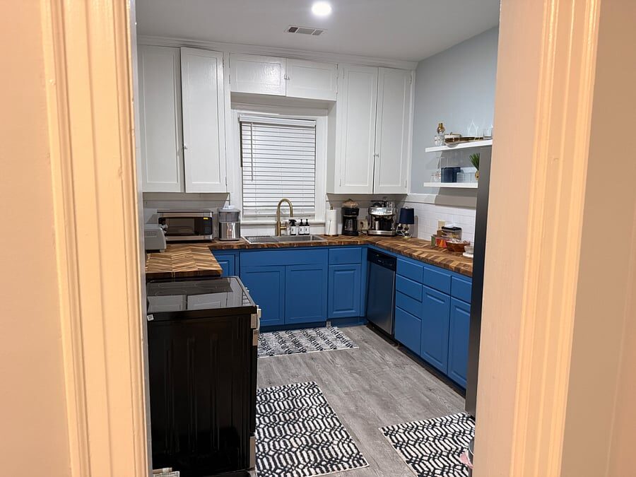 Blue Magnolia kitchen with blue cabinetry and patterned floor
