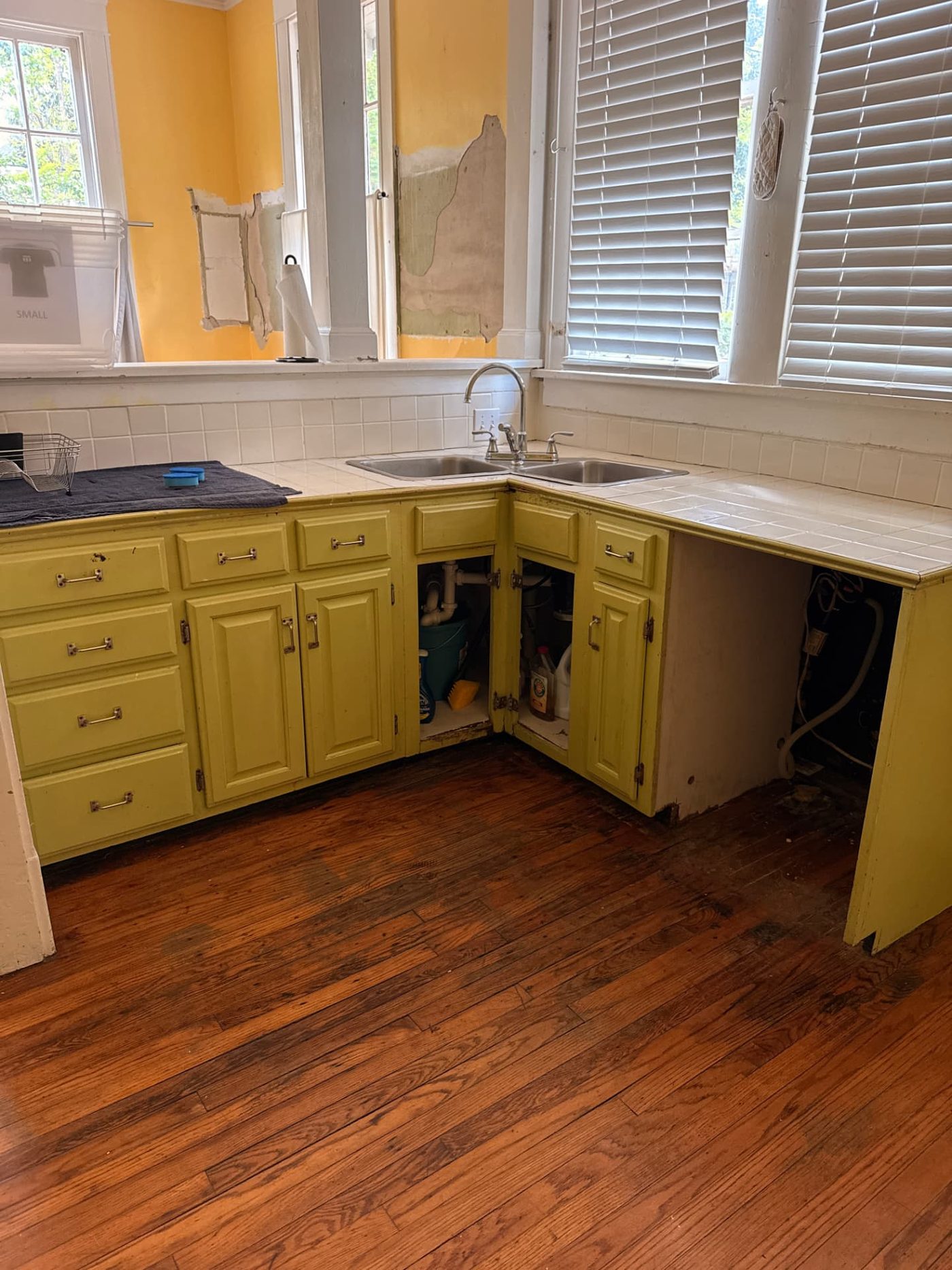 Lawrence project — original kitchen cabinets and tile countertop before renovation